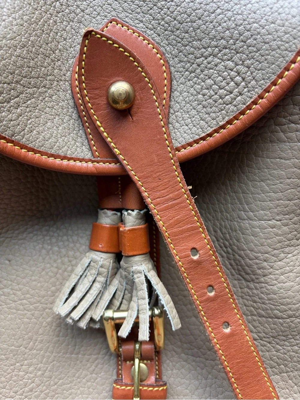 Dooney & Bourke Beige Leather Drawstring Backpack with Tan Trim